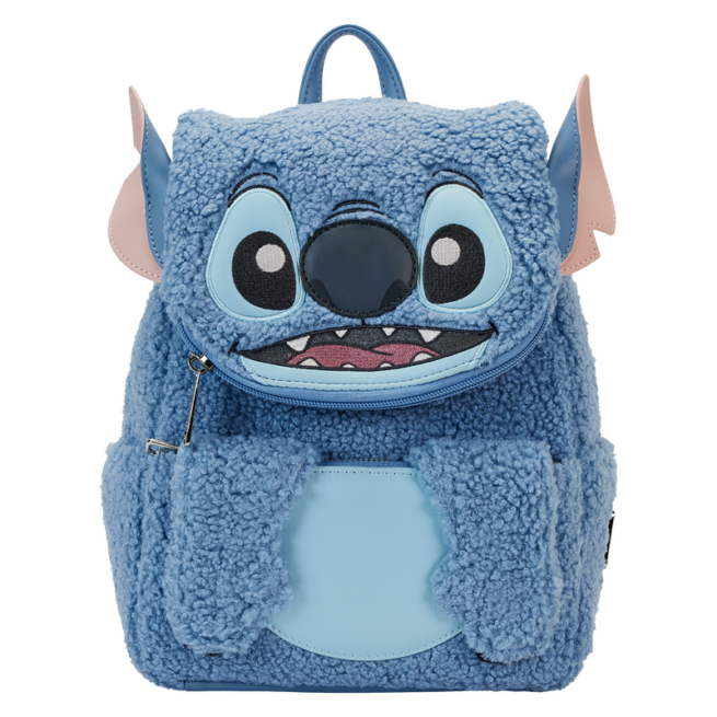 Need to escape? Our Loungefly Disney Stitch Plush Pocket Mini Backpack makes the perfect accomplice! This mini backpack is covered in blue sherpa material, and Stitch’s adorable face appears on the front. Just under his chin, you’ll find a zipper compartment for storing smaller items on your journeys. And, just under his paws, you’ll find another pocket. An invisible magnetic snap allows the paws to stay up while you secure your items. Applique ears poke out on the sides, and Stitch’s face comes to life in embroidered and applique details. On the back, you’ll find Scrump, surrounded by planets. Embrace your journeys in style with this fun and versatile accessory. Backpack features include silver-colored metal hardware, sherpa fabric, adjustable straps, vegan leather (polyurethane), side pockets, and applique, embroidered, and printed details. Note the coordinating lining. This backpack is an officially licensed Disney product. Backpack dimensions: 9” W x 10” H x 4.5” D (Width is measured across the bottom of the backpack.)